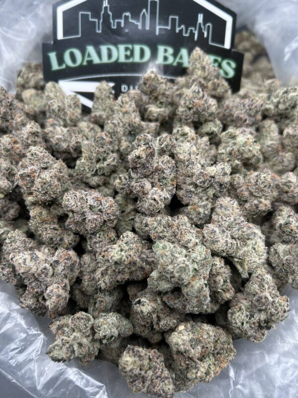 Close-up of Amarena Cherry Gelato cannabis flower with frosty trichomes and green-purple buds