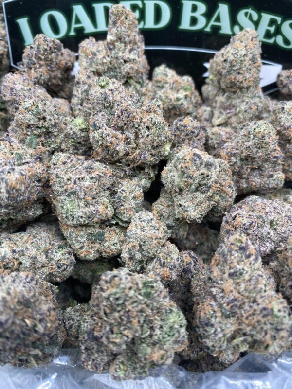 Close-up of ADL LCG cannabis flower with frosty green buds