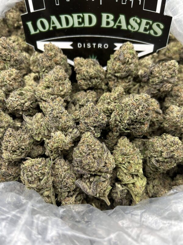 Close-up of Banana Kush cannabis flower with frosty trichomes and bright green buds