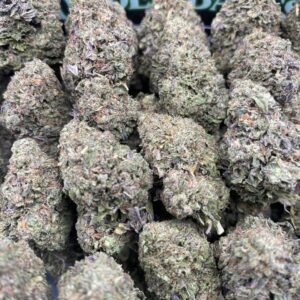 Close-up of Berry Mintz cannabis flower with frosty trichomes and green-purple hues