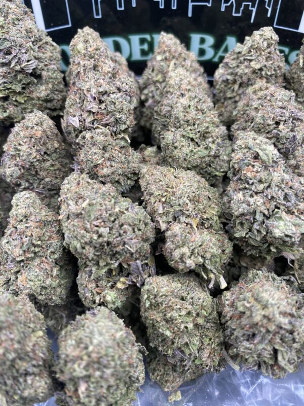 Close-up of Berry Mintz cannabis flower with frosty trichomes and green-purple hues