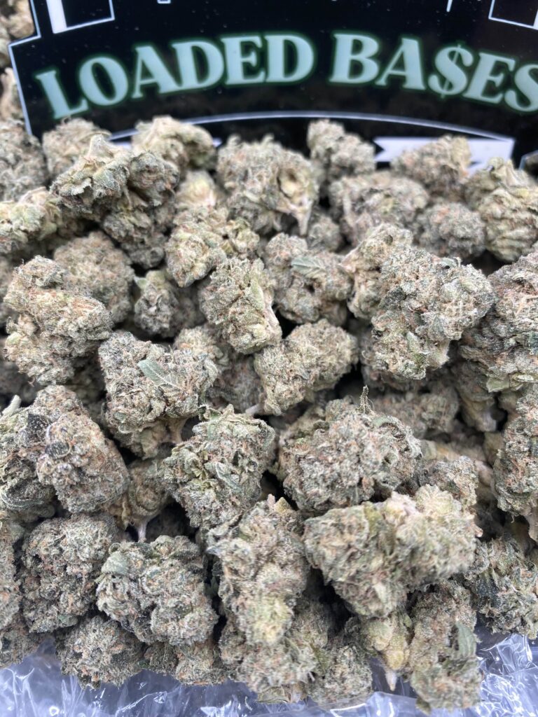 Close-up of Biscotti Smalls cannabis flower with frosty trichomes