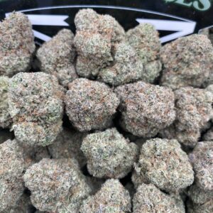 Close-up of Black Cherry cannabis flower with deep green and purple buds