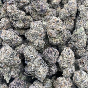 Close-up of Black Cherry Gelato cannabis flower with dense purple and green buds and sparkling trichomes