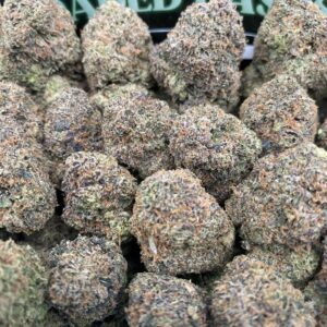 Grape Gelato cannabis flower with dense purple-tinged buds and sparkling trichomes