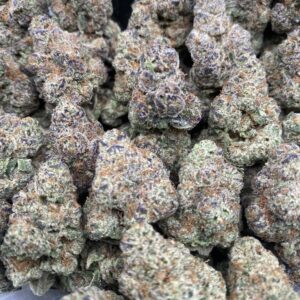 Grape Soda cannabis flower with dense purple-tinged buds and sparkling trichomes