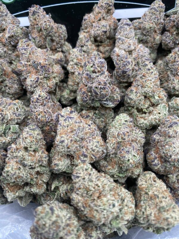 Grape Soda cannabis flower with dense purple-tinged buds and sparkling trichomes