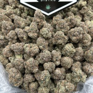 Guava Gas cannabis flower dense hybrid buds with tropical guava aroma and gassy undertones.
