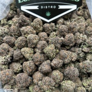 Melon Pop cannabis flower with frosty melon-colored buds