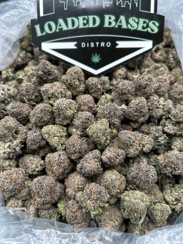 Melon Pop cannabis flower with frosty melon-colored buds
