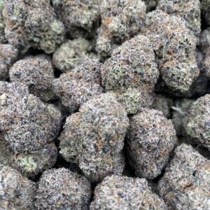 Mochi cannabis flower with frosty trichomes and colorful buds