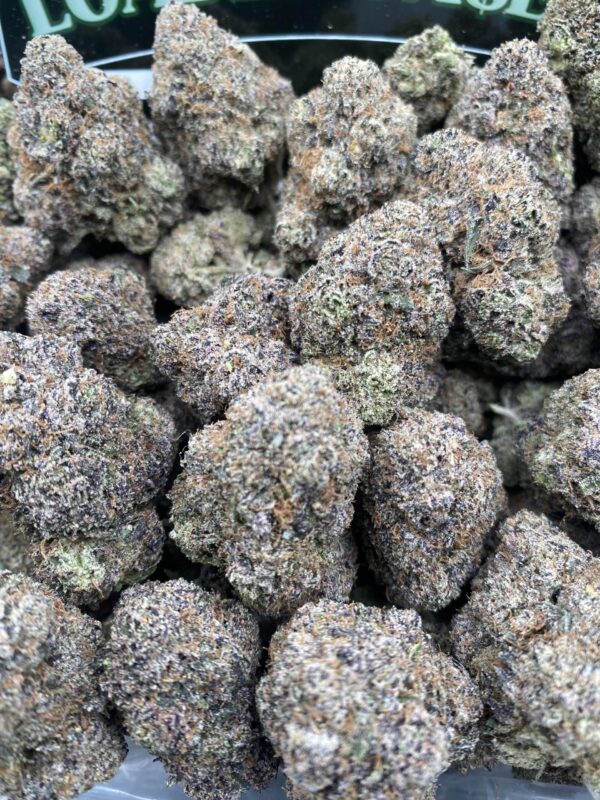 Mochi cannabis flower with frosty trichomes and colorful buds