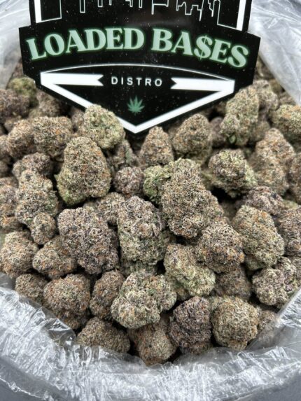 Mochi cannabis flower with frosty trichomes and colorful buds