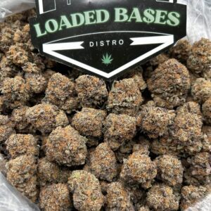 Purple Cake strain buds with purple hues and frosty trichomes