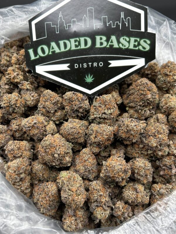Purple Cake strain buds with purple hues and frosty trichomes