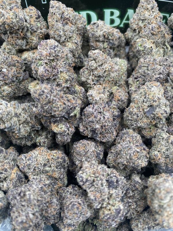 Super LCG cannabis flower buds with vibrant colors and frosty trichomes
