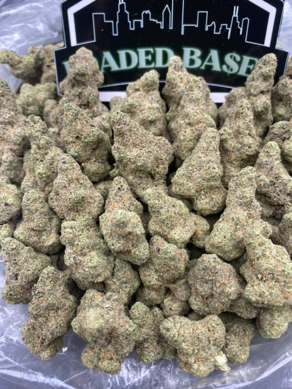 Tropical Runtz strain cannabis buds with frosty trichomes, sweet fruity hybrid weed
